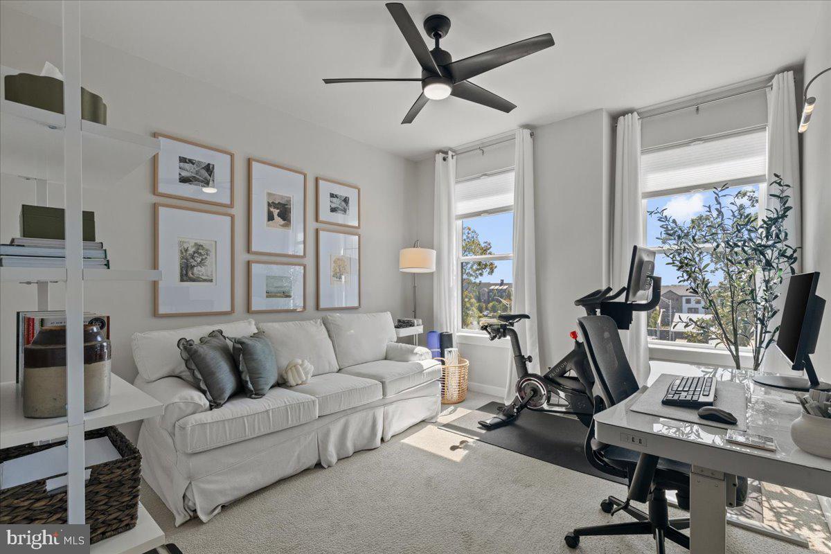 44614 Wolfhound Square Ashburn, VA 20147 - Photo 35 of 48 a living room with furniture a desk and a flat screen tv