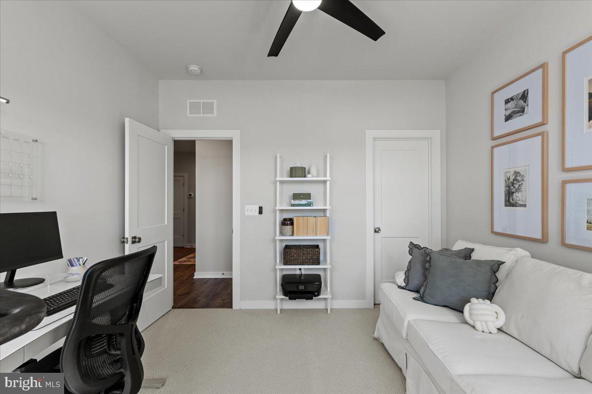 44614 Wolfhound Square Ashburn, VA 20147 - Photo 36 of 48 a living room with furniture and painting on the wall