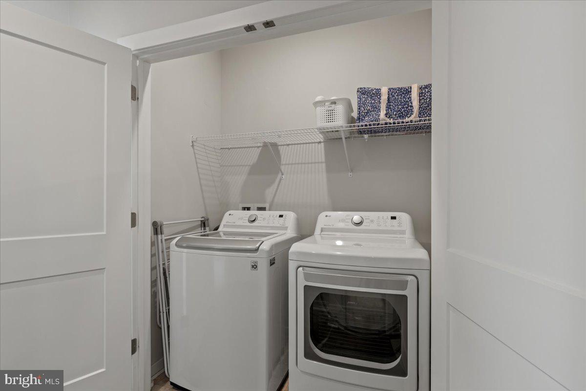 44614 Wolfhound Square Ashburn, VA 20147 - Photo 39 of 48 a utility room with dryer and washer