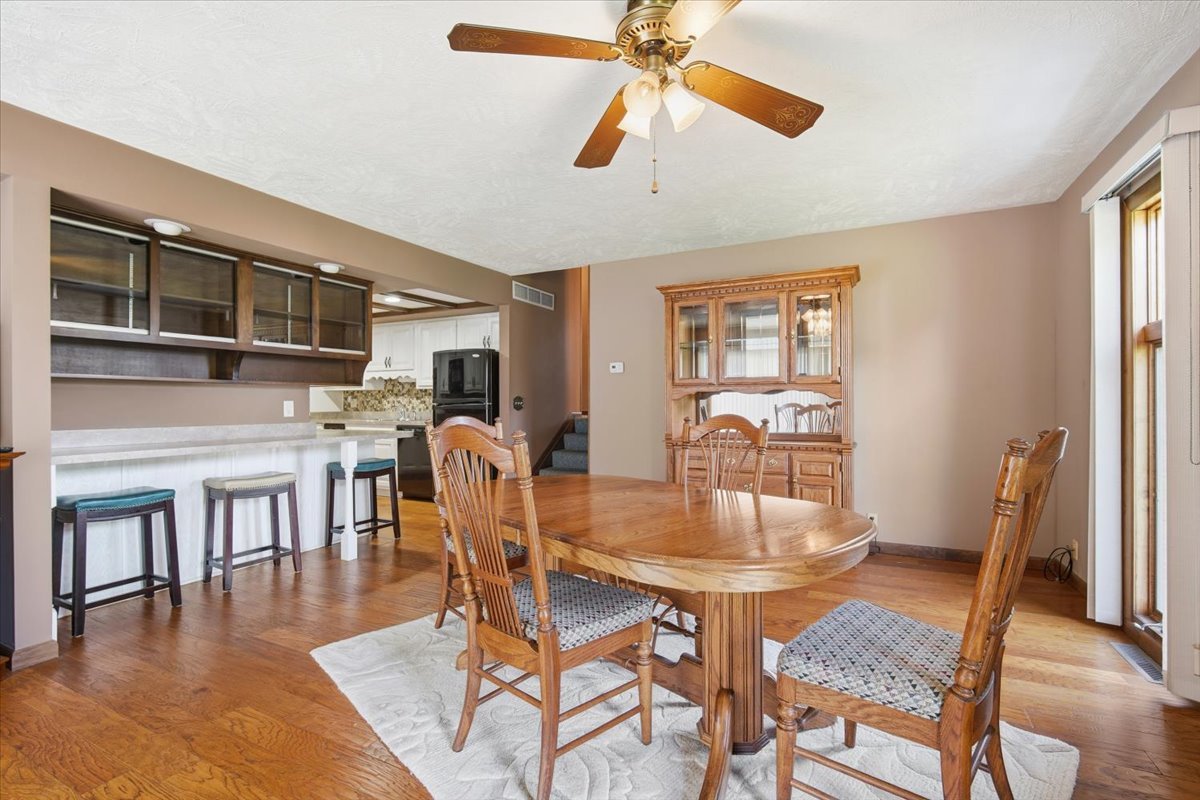 504 South School Street Minier, IL 61759 - Photo 12 of 46 a view of a dining room with furniture window and wooden floor
