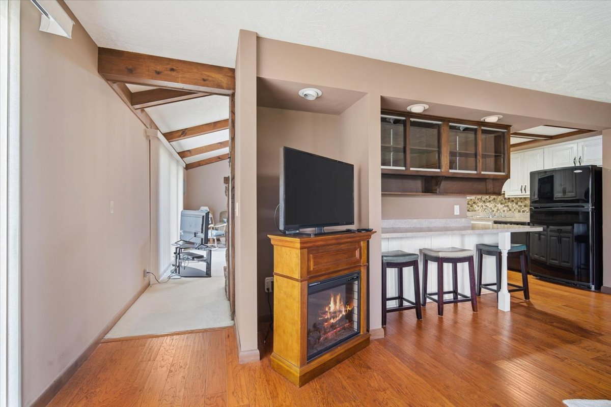 504 South School Street Minier, IL 61759 - Photo 14 of 46 a living room with stainless steel appliances furniture a flat screen tv and kitchen view