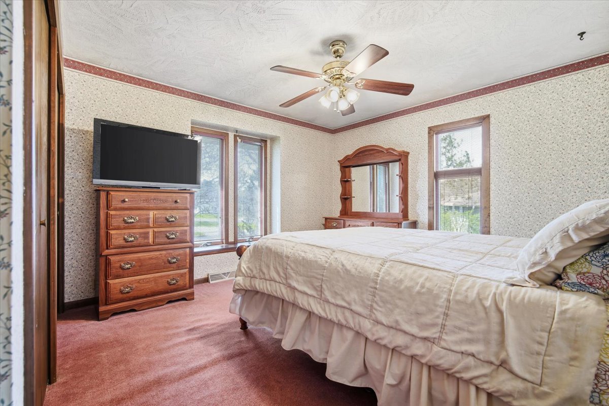 504 South School Street Minier, IL 61759 - Photo 22 of 46 a bedroom with a bed and a flat screen tv