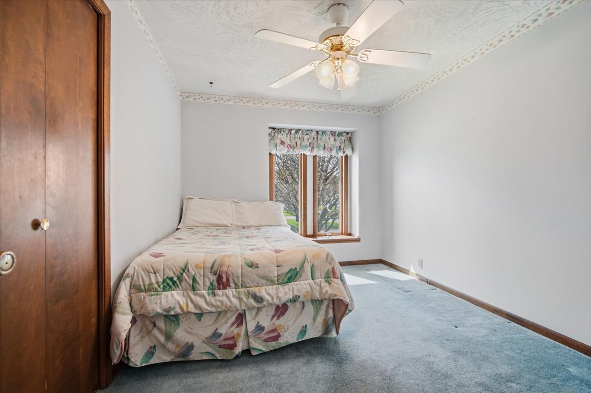 504 South School Street Minier, IL 61759 - Photo 23 of 46 a bedroom with a bed and a window