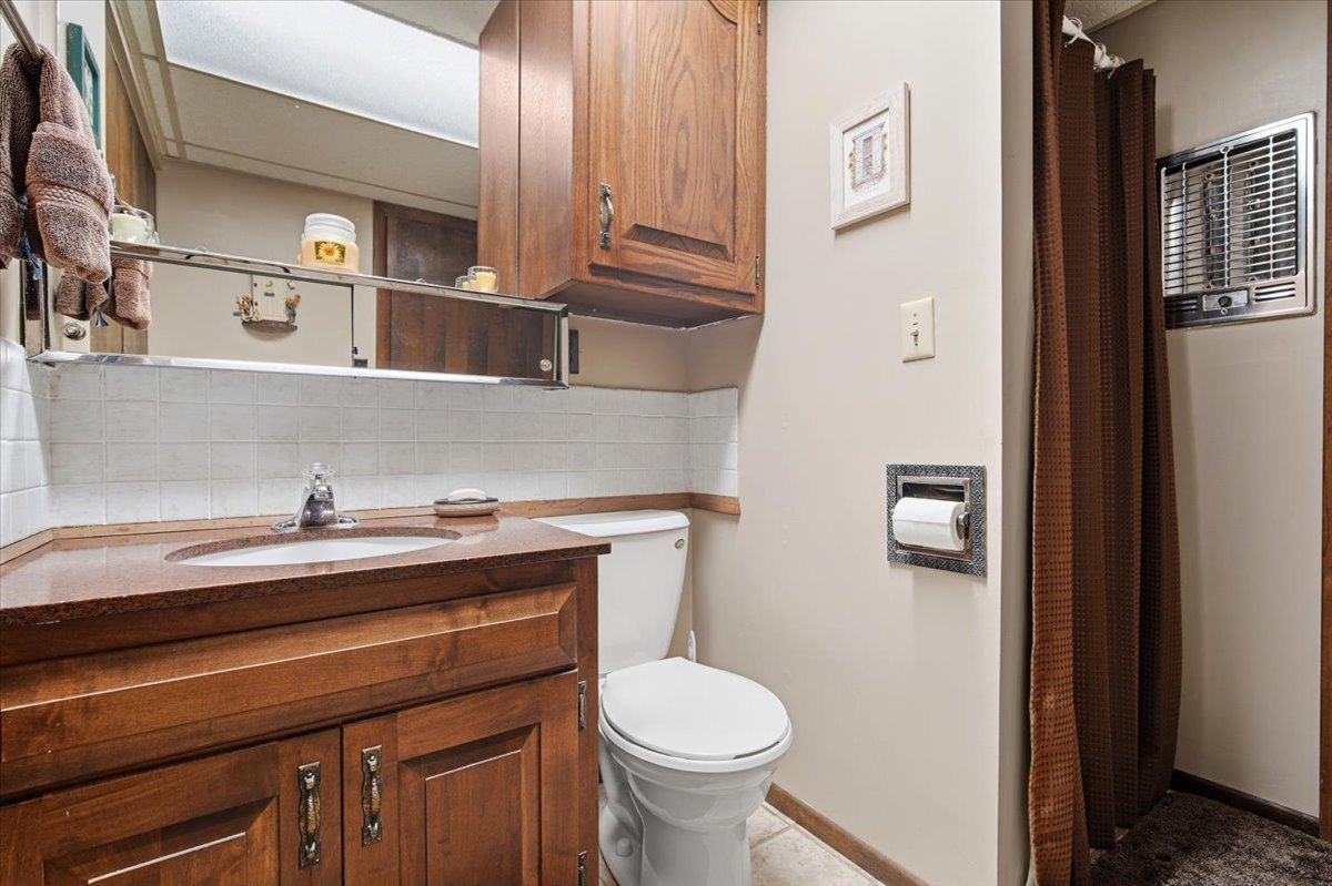 504 South School Street Minier, IL 61759 - Photo 32 of 46 a bathroom with a sink and a toilet