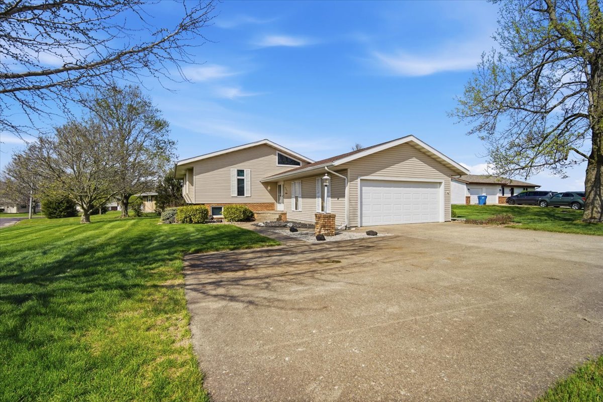 504 South School Street Minier, IL 61759 - Photo 42 of 46 a view of a house with a big yard and large tree