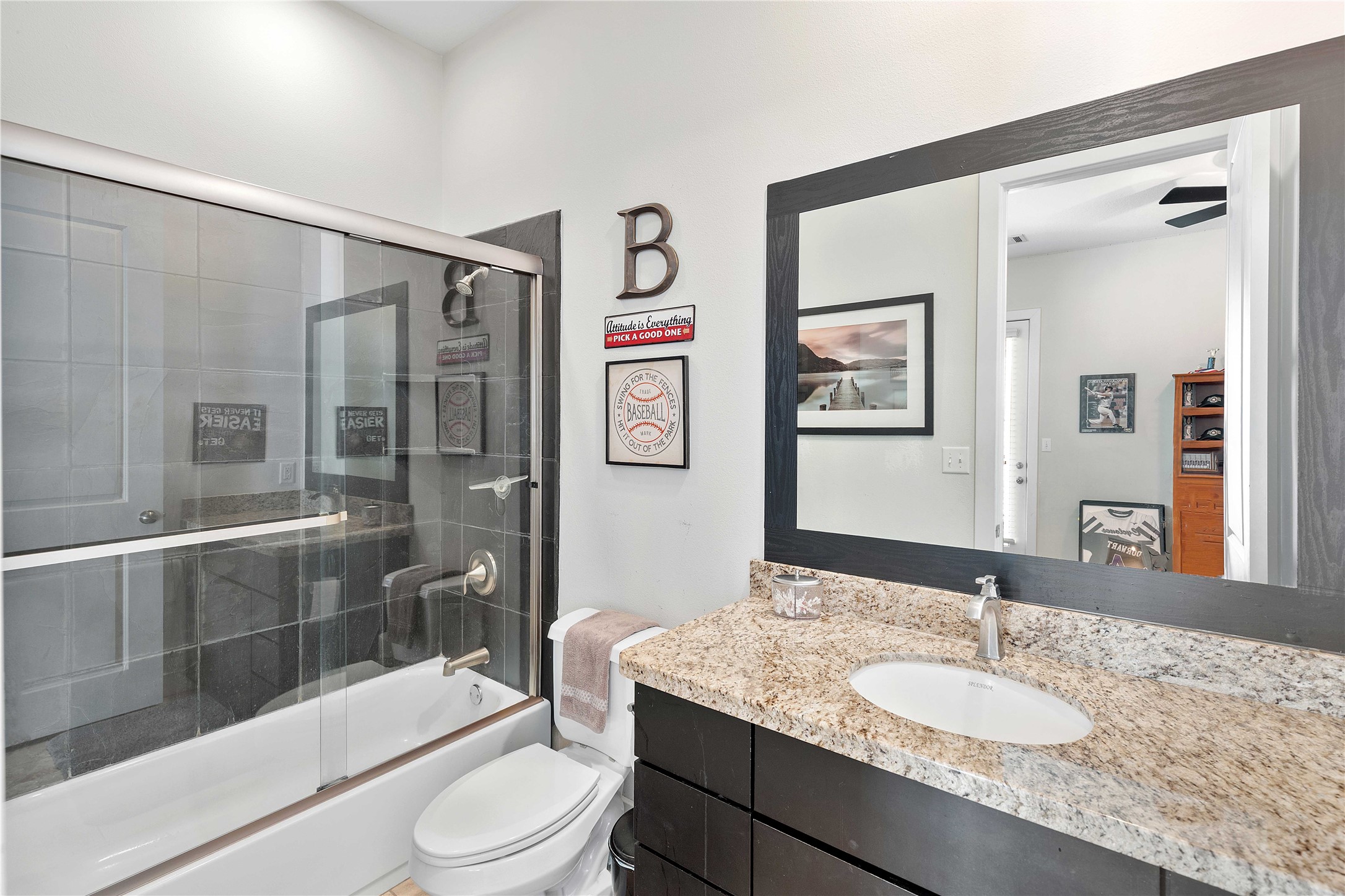 11434 Ketch Court Willis, TX 77318 - Photo 38 of 50 a bathroom with a granite countertop sink toilet and shower