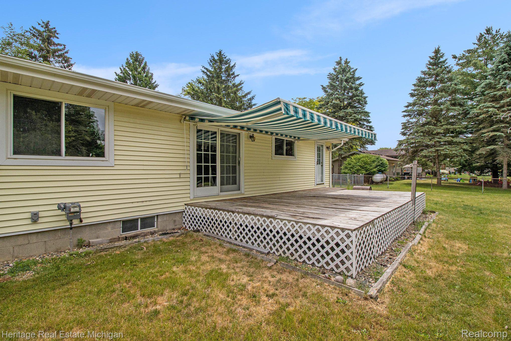 1267 Oakcrest Road Howell, MI 48843 - Photo 15 of 19 Back deck with awning