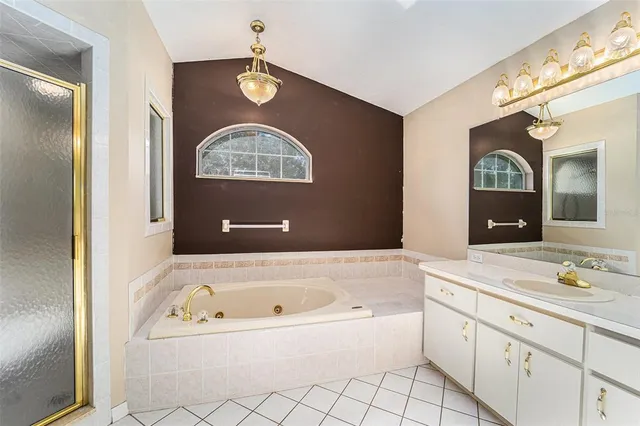 a bathroom with a bathtub and a sink