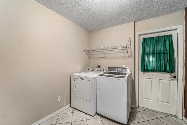 a view of a storage & utility room with washer and dryer