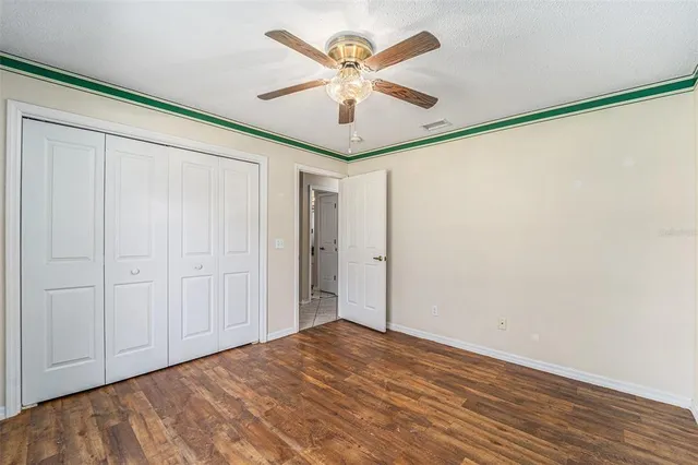 a view of a livingroom with a chandelier fan