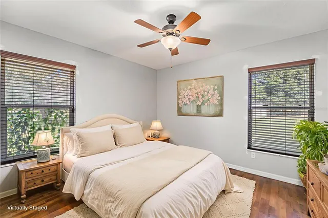 a bedroom with a large bed and a window