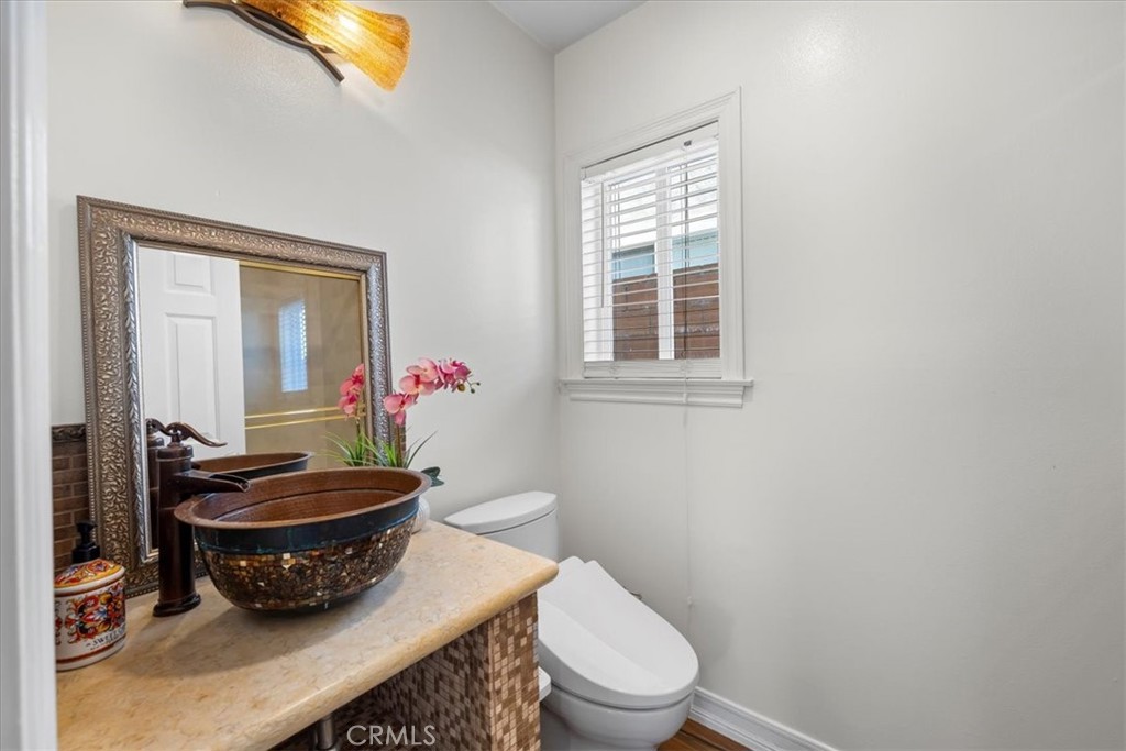 1035 Avenue D Redondo Beach, CA 90277 - Photo 13 of 66 a bathroom with a toilet a sink and a mirror