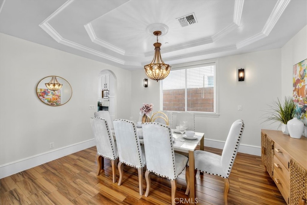 1035 Avenue D Redondo Beach, CA 90277 - Photo 16 of 66 a dining room with furniture a potted plant and a chandelier