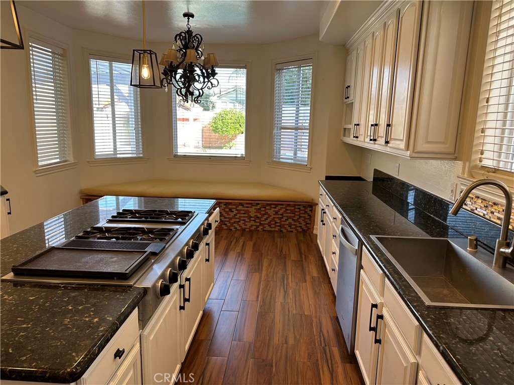 1035 Avenue D Redondo Beach, CA 90277 - Photo 23 of 66 a kitchen with wooden cabinets stove and sink