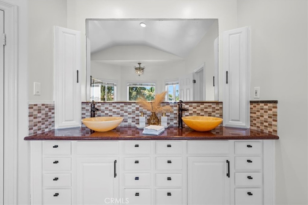 1035 Avenue D Redondo Beach, CA 90277 - Photo 48 of 66 a bathroom with a granite countertop sink and a mirror