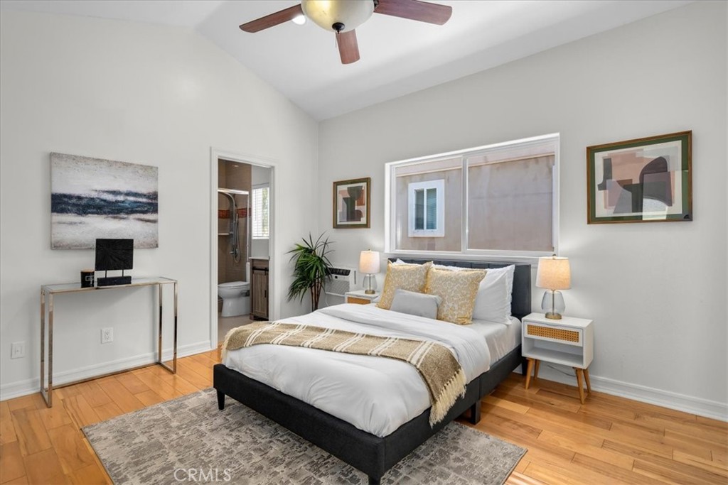 1035 Avenue D Redondo Beach, CA 90277 - Photo 49 of 66 a spacious bedroom with a large bed and a chandelier