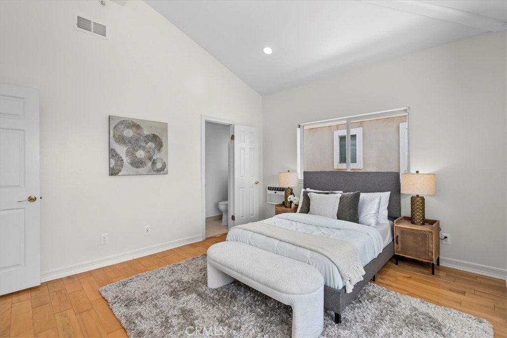 1035 Avenue D Redondo Beach, CA 90277 - Photo 54 of 66 a bedroom with a bed and wooden floor