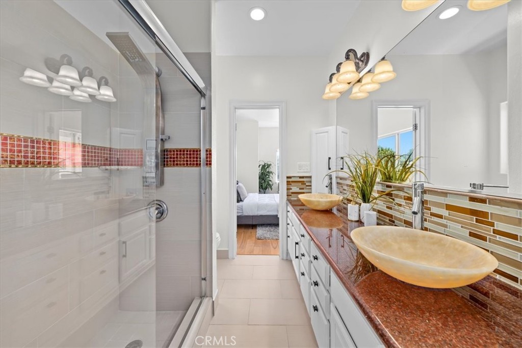1035 Avenue D Redondo Beach, CA 90277 - Photo 58 of 66 a bathroom with a double vanity sink and a mirror