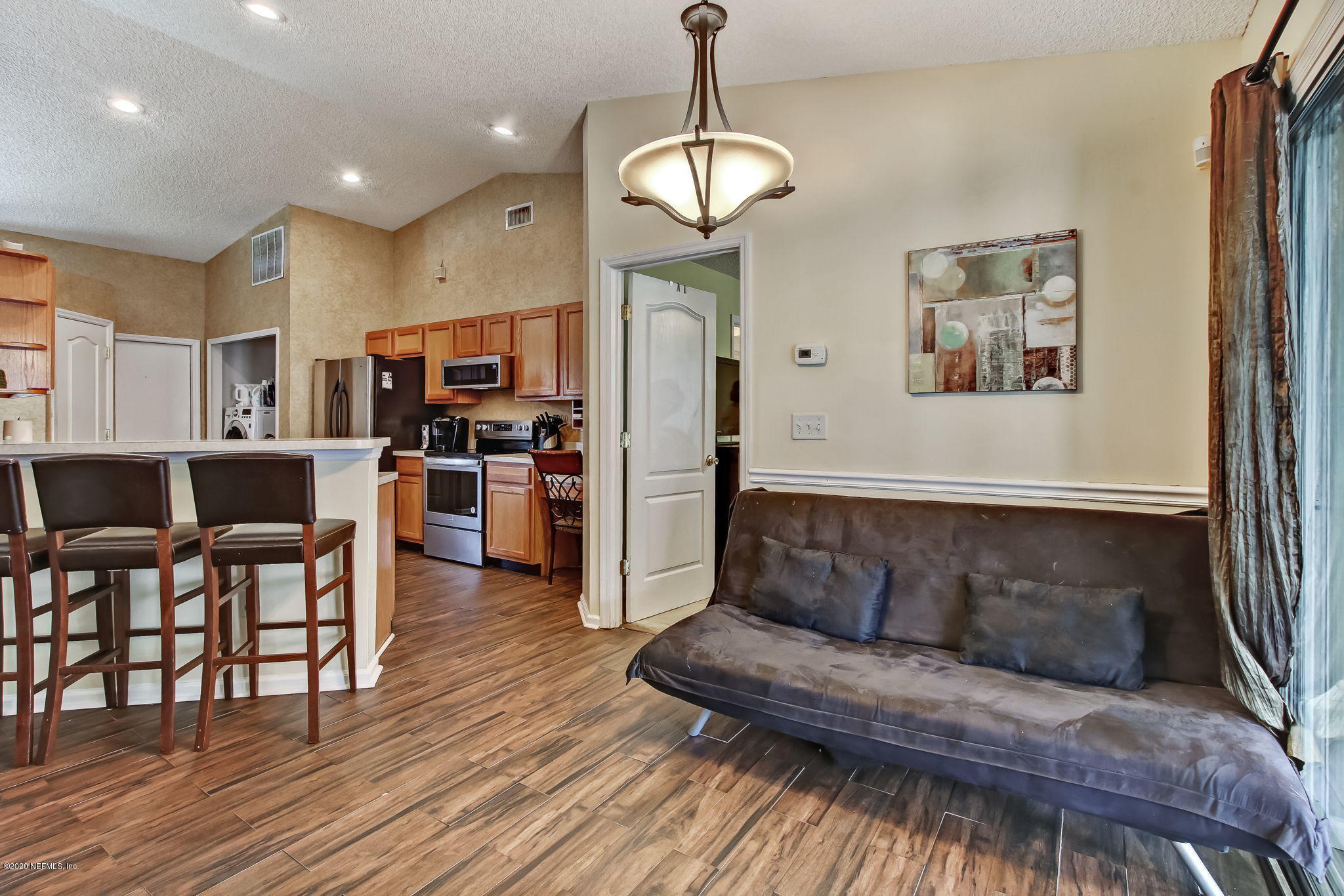 2499 Paris Mill Road Jacksonville, FL 32221 - Photo 22 of 60 a living room with furniture and kitchen view