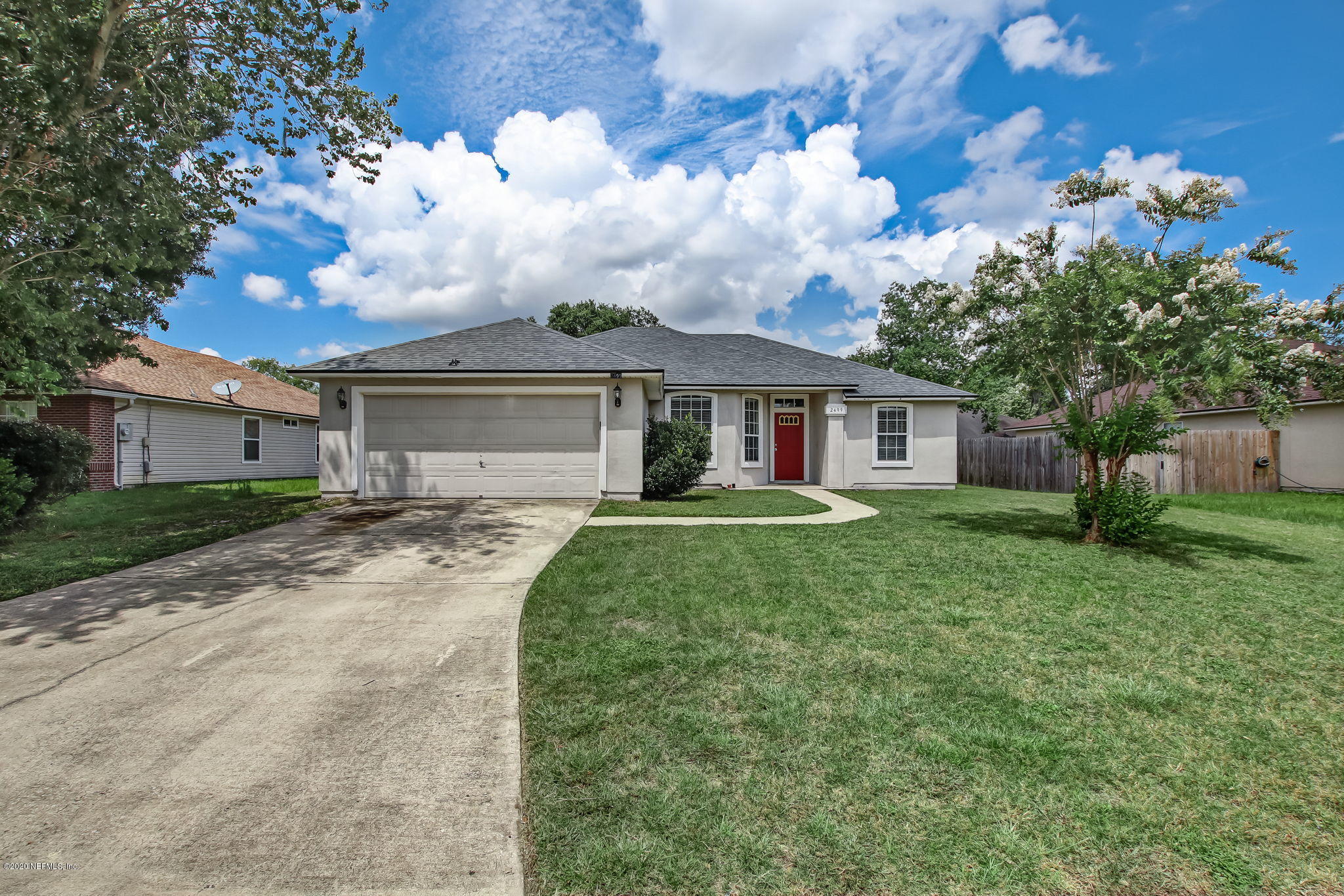 2499 Paris Mill Road Jacksonville, FL 32221 - Photo 4 of 60 a front view of a house with garden