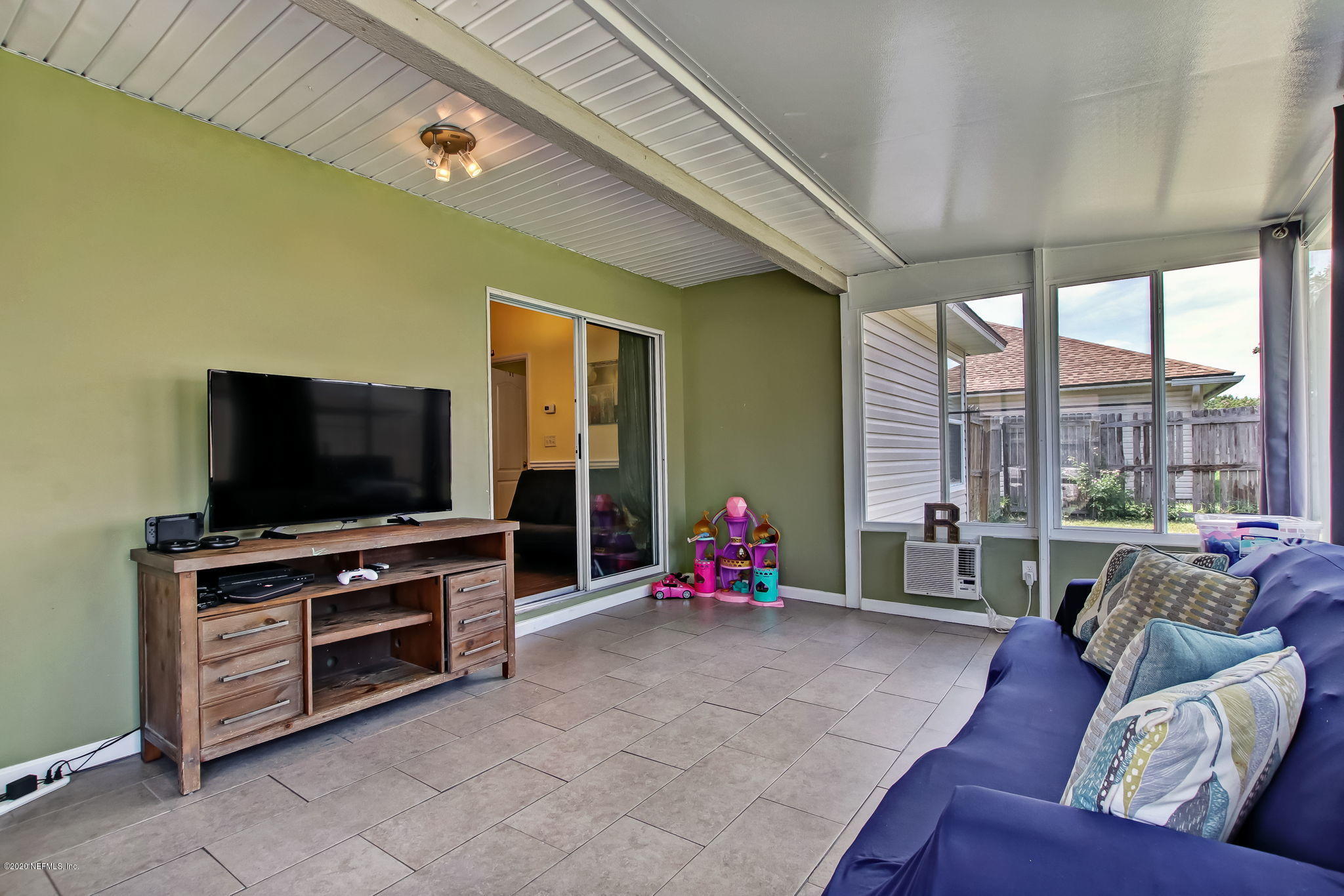 2499 Paris Mill Road Jacksonville, FL 32221 - Photo 44 of 60 a living room with furniture and a flat screen tv