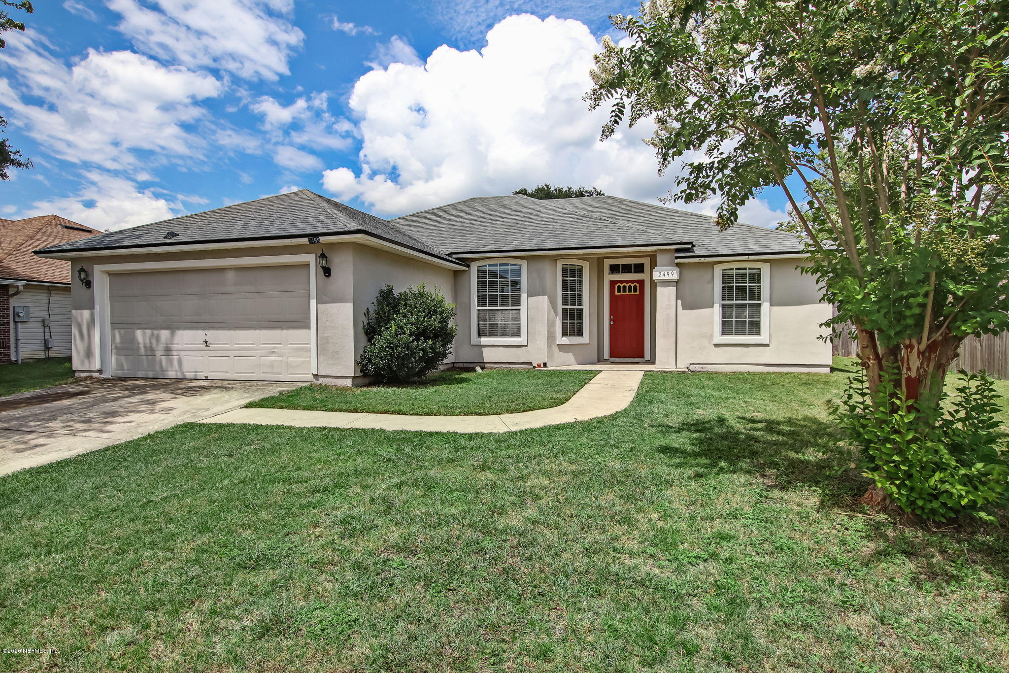 2499 Paris Mill Road Jacksonville, FL 32221 - Photo 6 of 60 a front view of house with yard and green space
