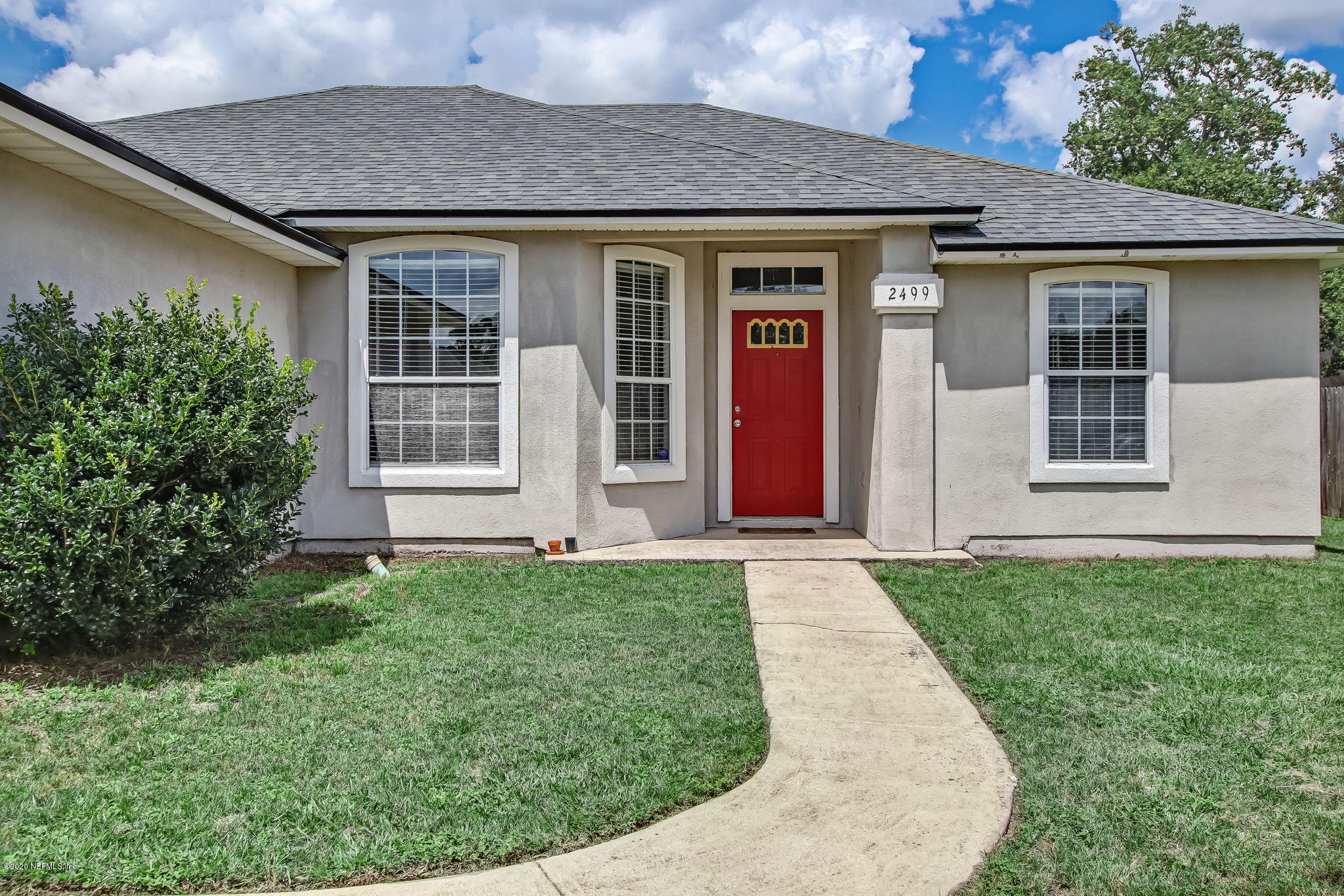 2499 Paris Mill Road Jacksonville, FL 32221 - Photo 8 of 60 front view of a house with a yard