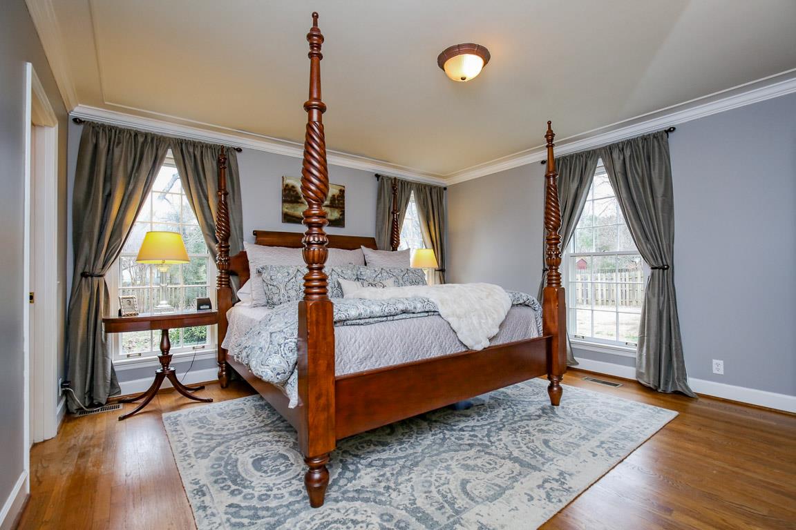 143 Alton Road Nashville, TN 37205 - Photo 19 of 25 a bedroom with bed and wooden floor