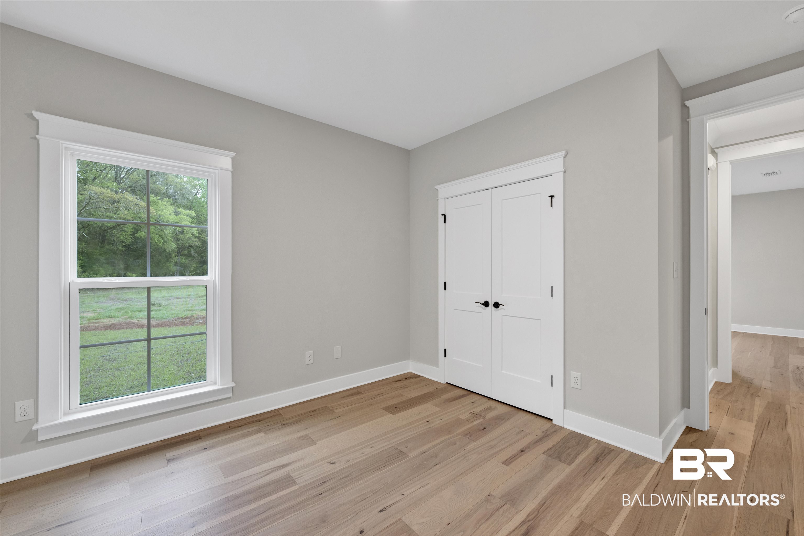 27382 Patch Pl Loop Daphne, AL 36526 - Photo 28 of 31 Unfurnished bedroom with light wood-style flooring and a closet