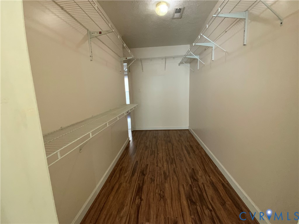 2708 Goyne Loop Chester, VA 23831 - Photo 12 of 17 Walk in closet featuring dark wood-style floors