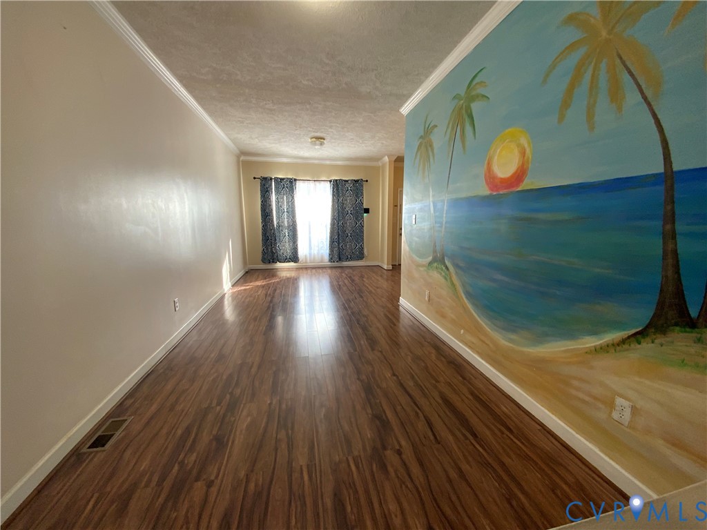 2708 Goyne Loop Chester, VA 23831 - Photo 2 of 17 Spare room featuring a textured ceiling, dark wood