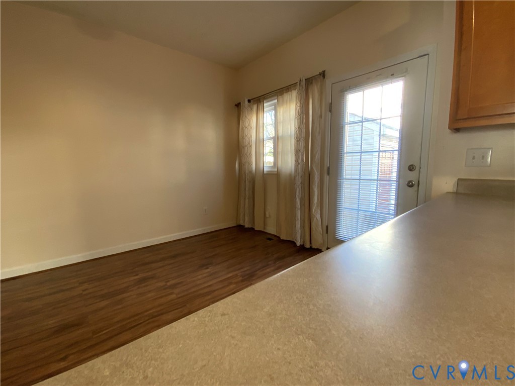 2708 Goyne Loop Chester, VA 23831 - Photo 7 of 17 Unfurnished room with dark wood-type flooring and