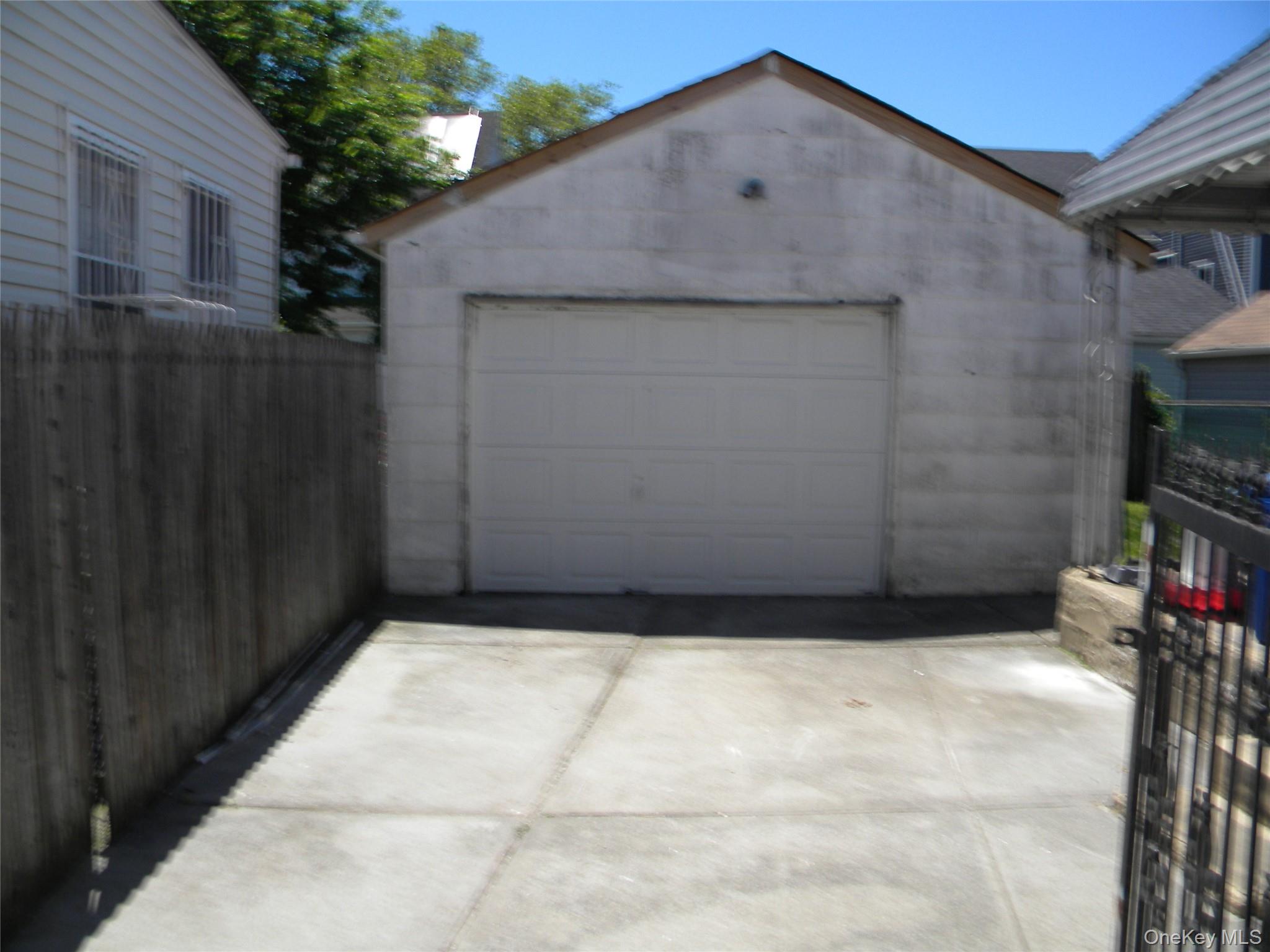 241-26 86th Road Queens, NY 11426 - Photo 35 of 38 a backyard of a house