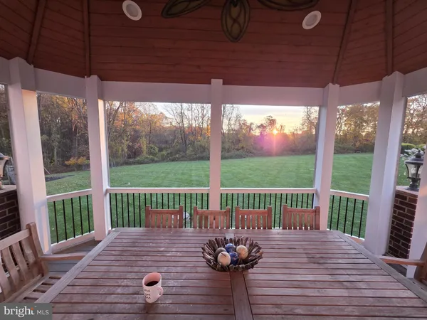 a view of a deck with wooden floor and outdoor seating