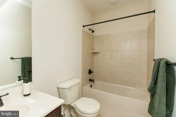 a bathroom with a sink a window and a mirror