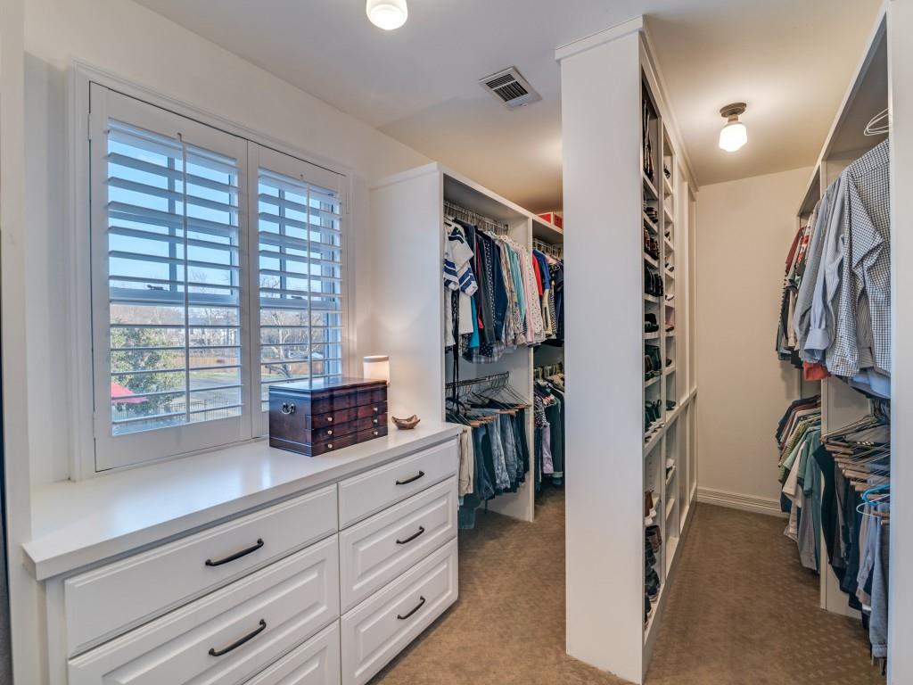 343 East Tripp Road Sunnyvale, TX 75182 - Photo 20 of 36 a view of walk in closet with clothes and shoes