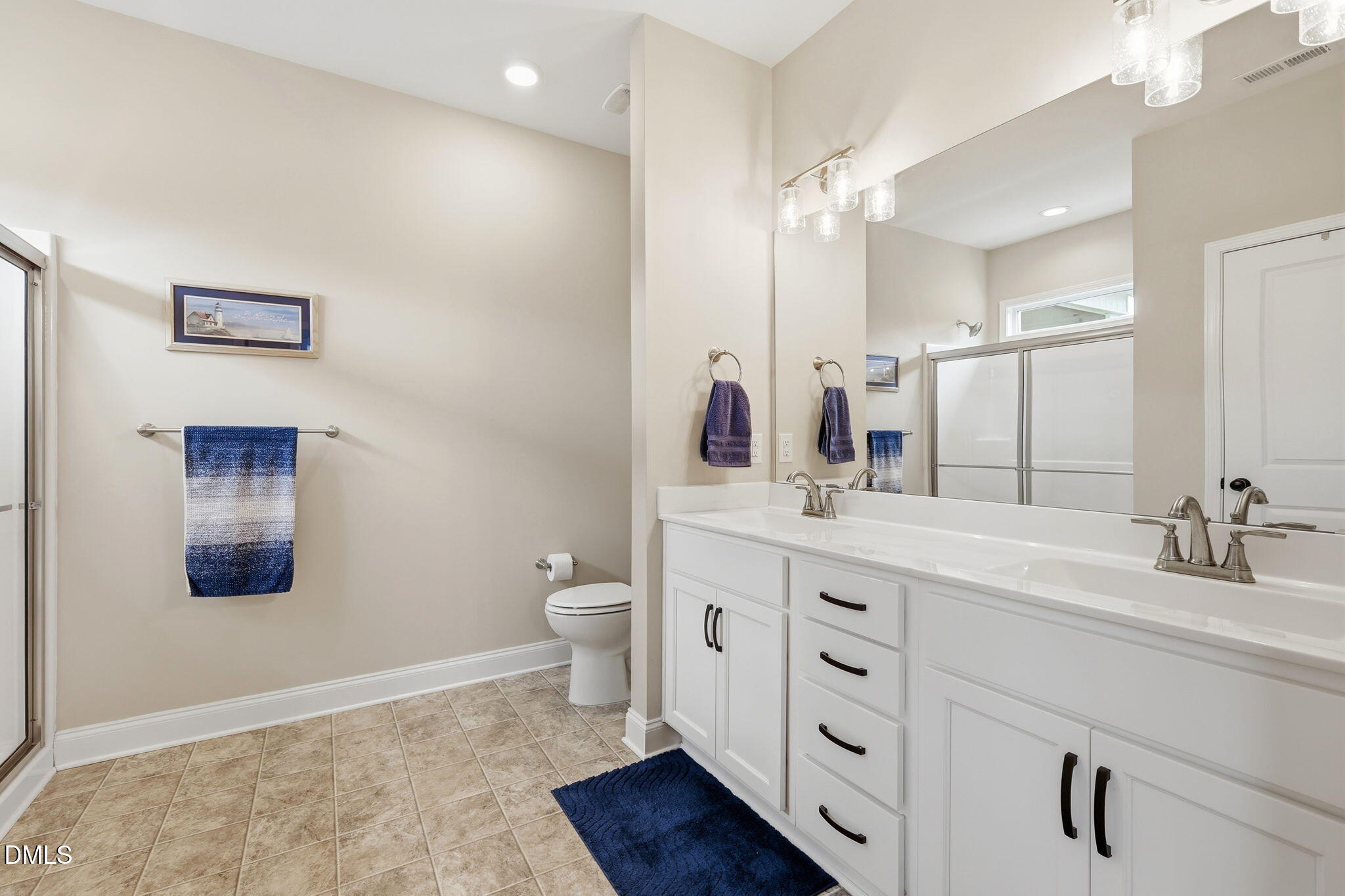 5098 Spring Hill Church Road Lillington, NC 27546 - Photo 16 of 36 a bathroom with a double vanity sink mirror and toilet