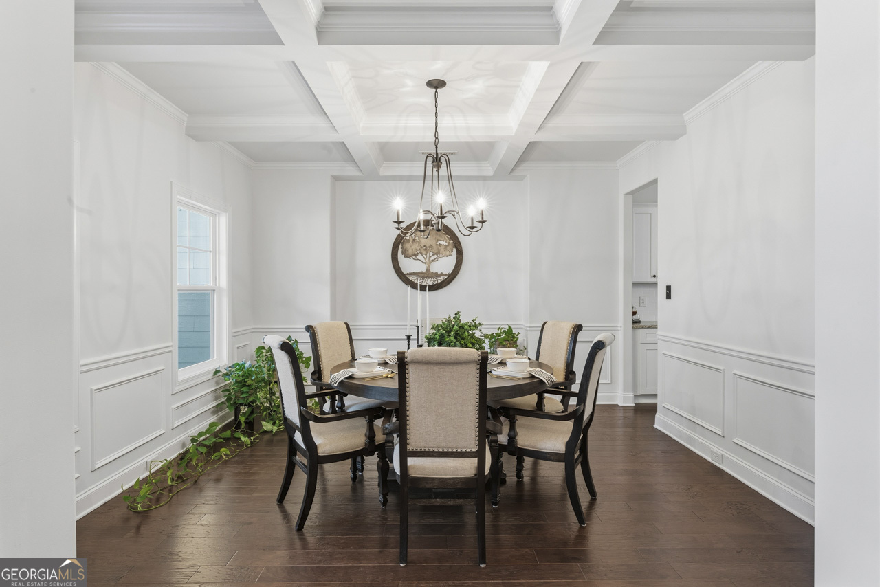 1058 Lawshe Road Senoia, GA 30276 - Photo 16 of 48 a view of a dining room with furniture window and wooden floor