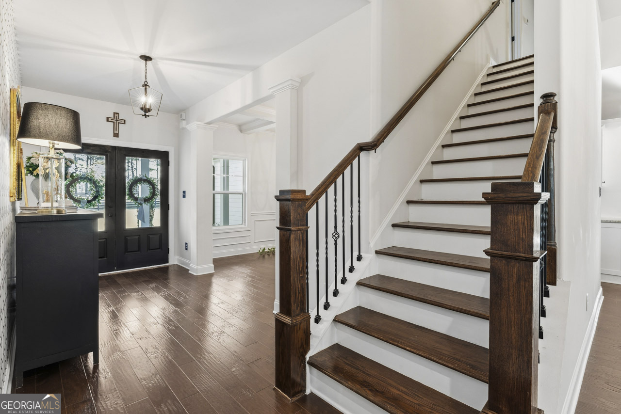 1058 Lawshe Road Senoia, GA 30276 - Photo 18 of 48 a view of entryway and hall with wooden floor