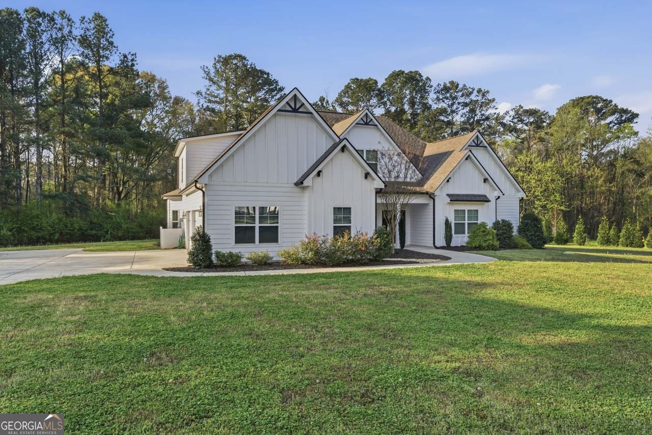 1058 Lawshe Road Senoia, GA 30276 - Photo 2 of 48 a view of a house and outdoor space and yard