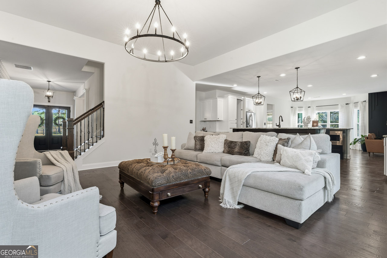 1058 Lawshe Road Senoia, GA 30276 - Photo 21 of 48 a living room with furniture and kitchen view
