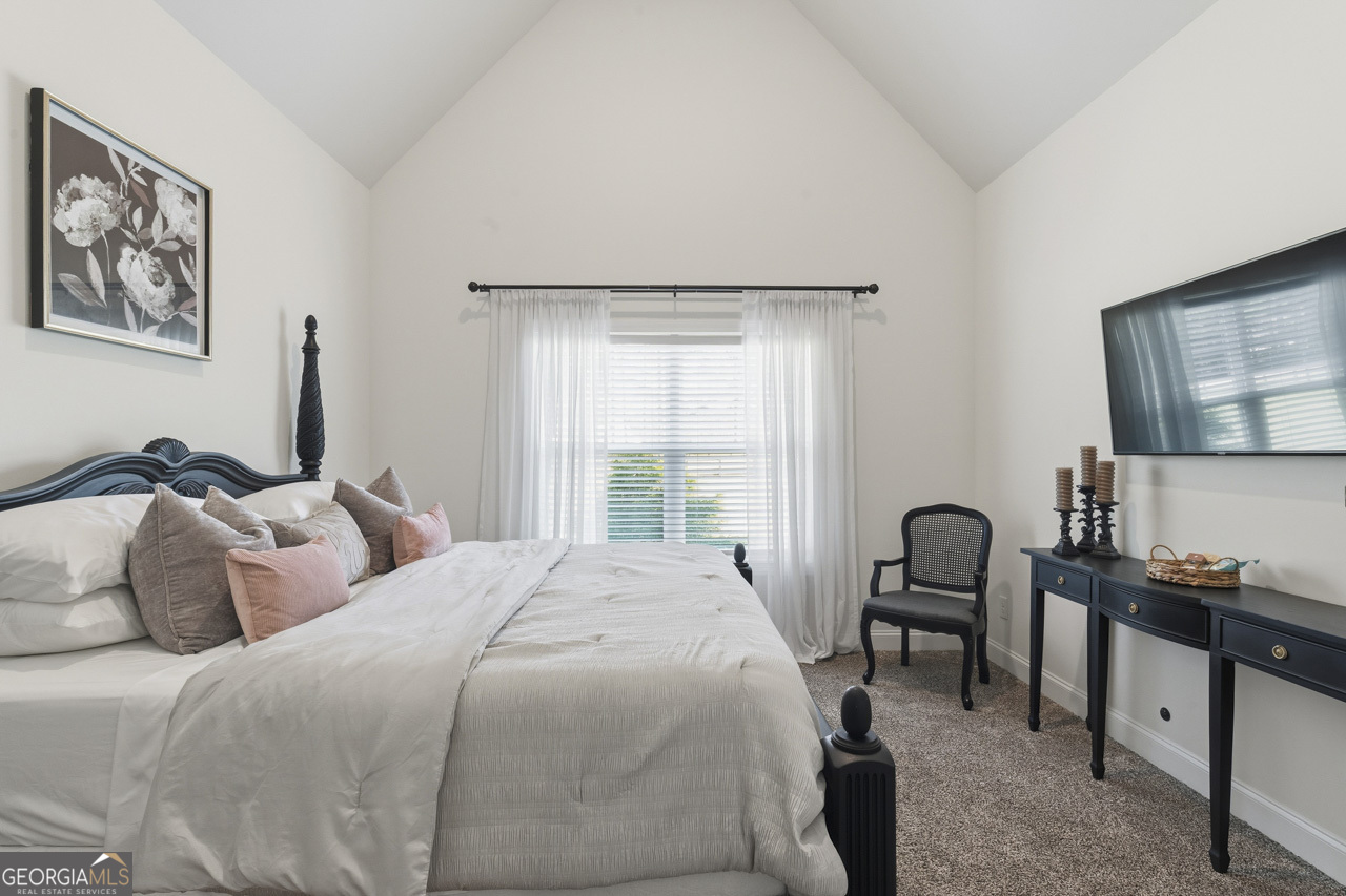 1058 Lawshe Road Senoia, GA 30276 - Photo 27 of 48 a bedroom with a bed and a window