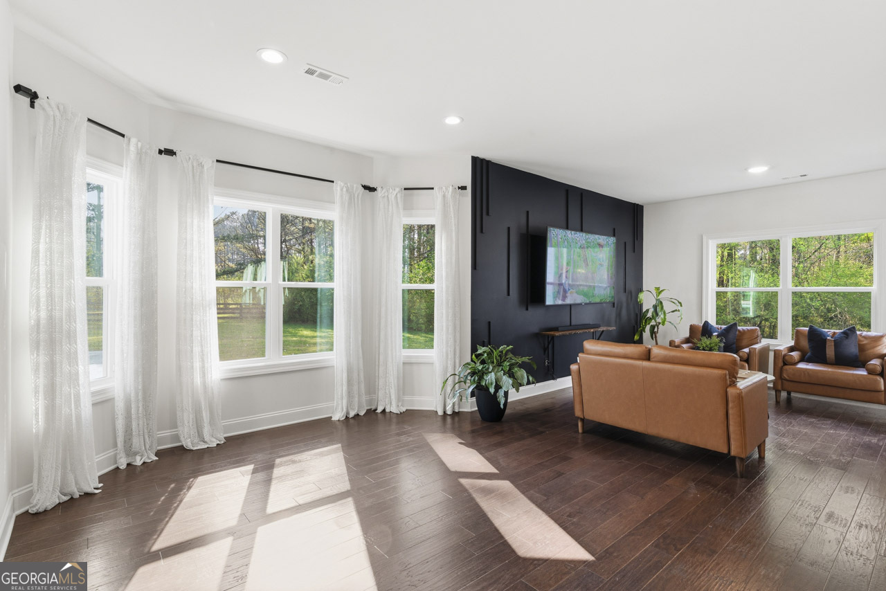 1058 Lawshe Road Senoia, GA 30276 - Photo 35 of 48 a living room with furniture and windows