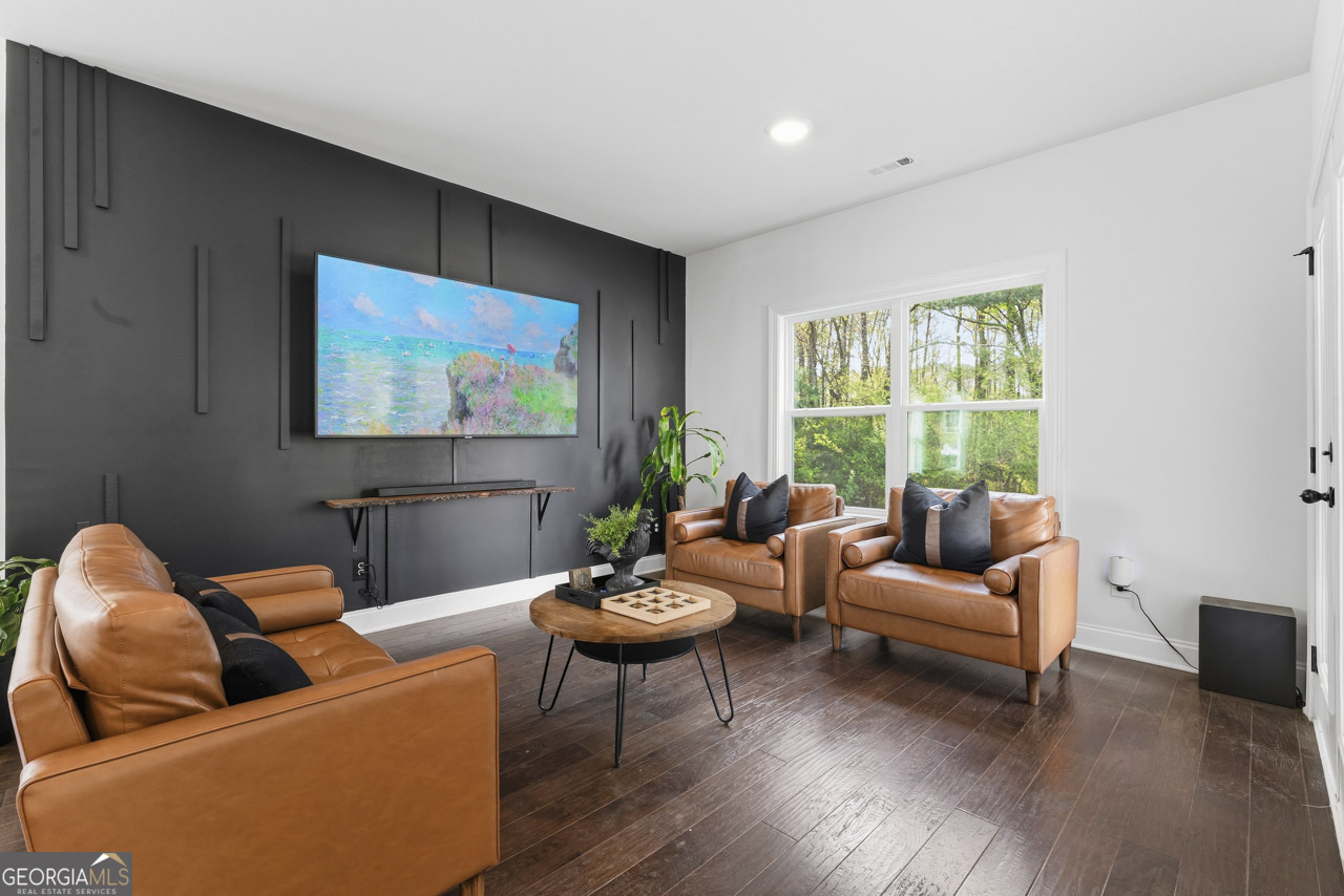 1058 Lawshe Road Senoia, GA 30276 - Photo 36 of 48 a living room with furniture and a large window