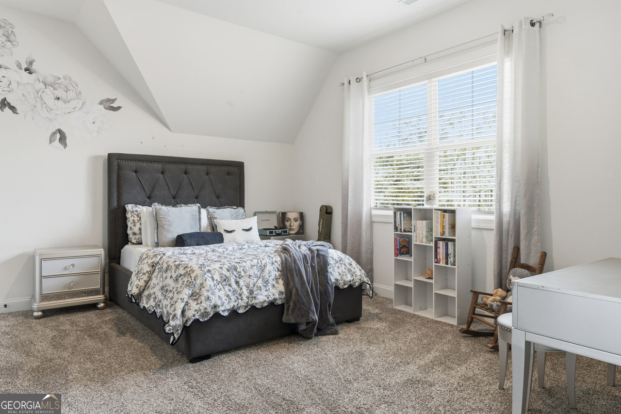 1058 Lawshe Road Senoia, GA 30276 - Photo 39 of 48 a bedroom with a bed and a window