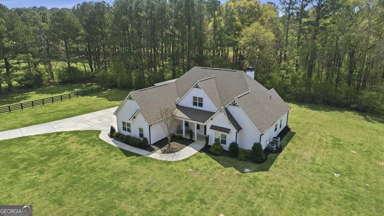 1058 Lawshe Road Senoia, GA 30276 - Photo 4 of 48 a aerial view of a house with yard and sitting area