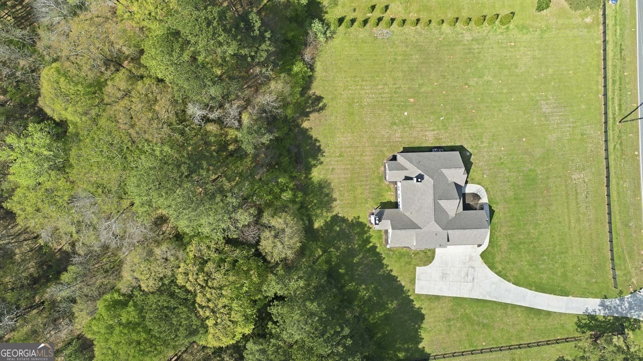 1058 Lawshe Road Senoia, GA 30276 - Photo 7 of 48 a view of a bathroom with a sink and mirror