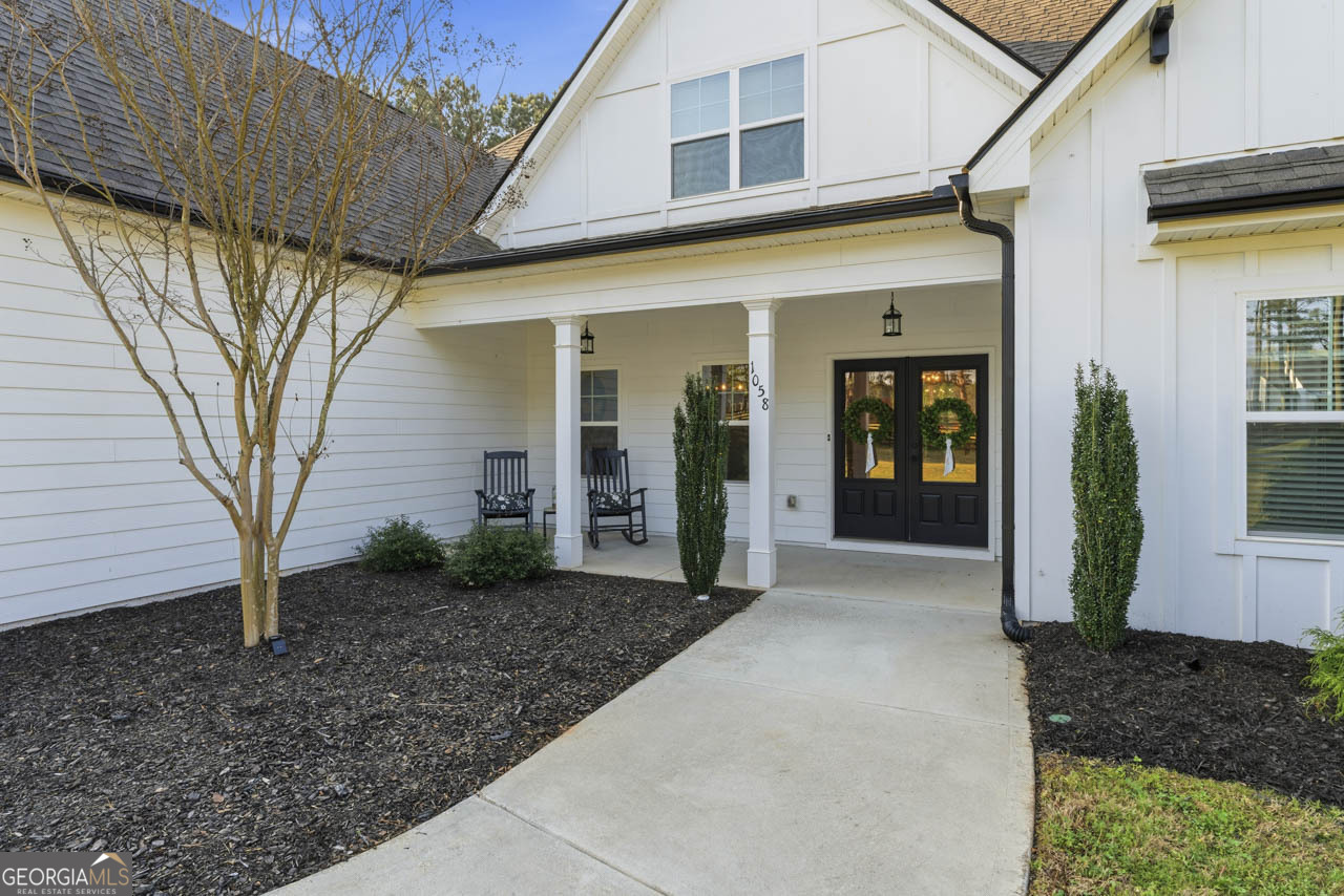 1058 Lawshe Road Senoia, GA 30276 - Photo 8 of 48 a view of a house with a backyard