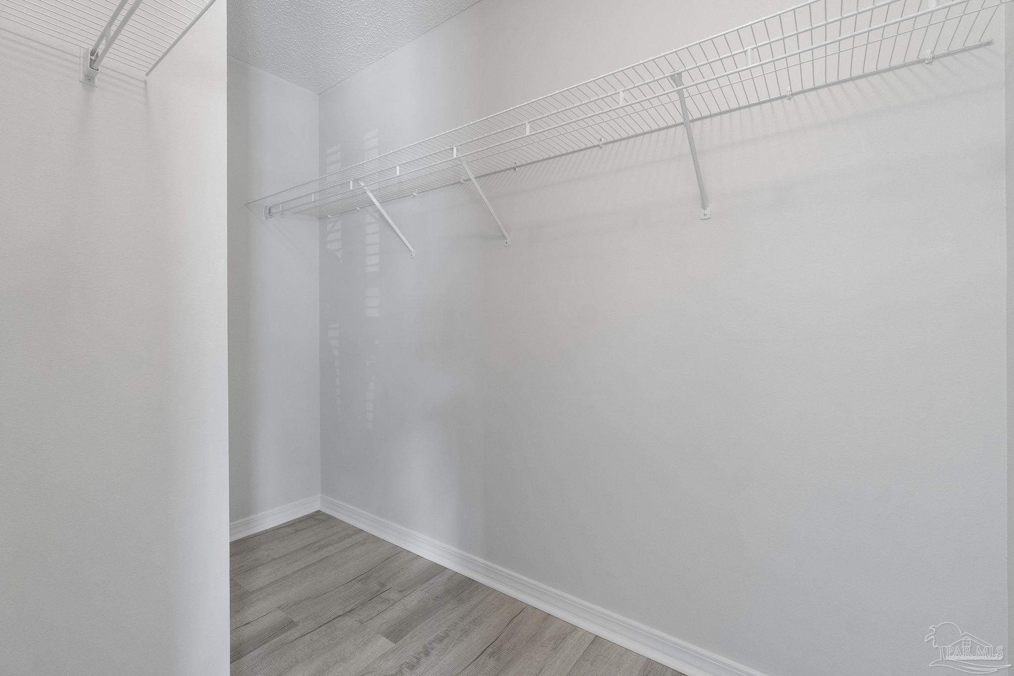 7253 Pro Lane Milton, FL 32570 - Photo 21 of 33 a view of a room with wooden floor