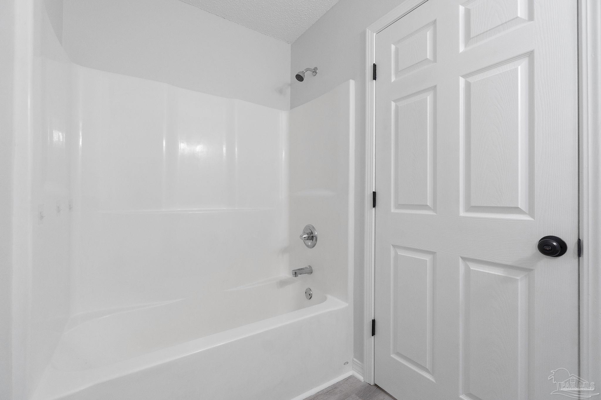 7253 Pro Lane Milton, FL 32570 - Photo 26 of 33 a bathroom with a bathtub